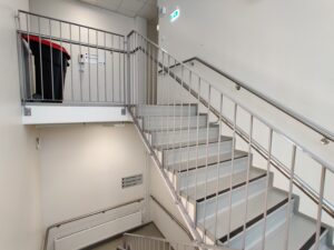 Metal handrails for concrete stairs